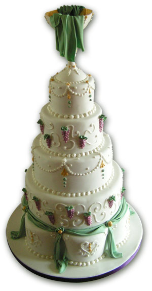 Giant white, purple and green wedding cake